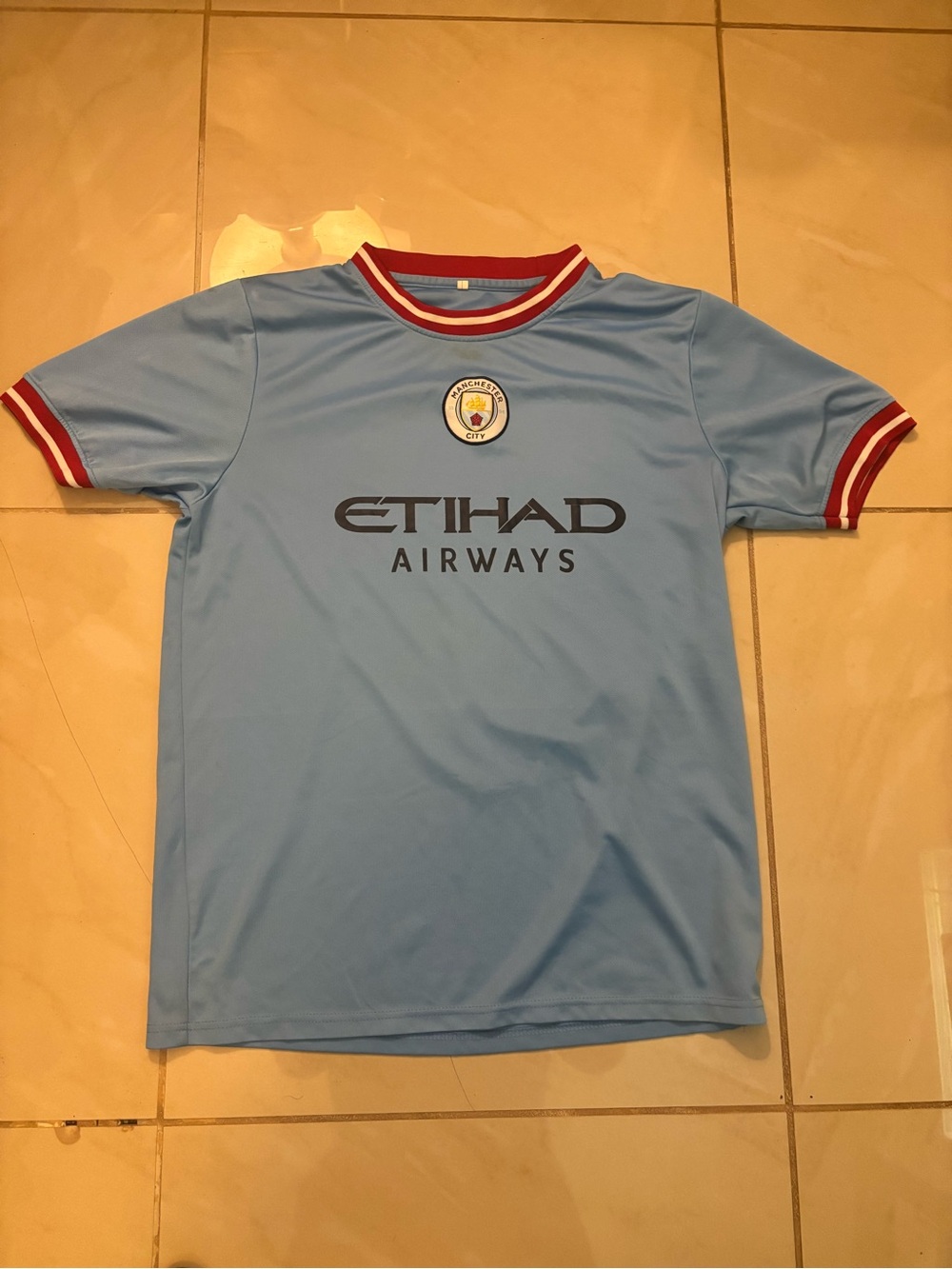 Light Blue Football Jersey with Etihad Logo